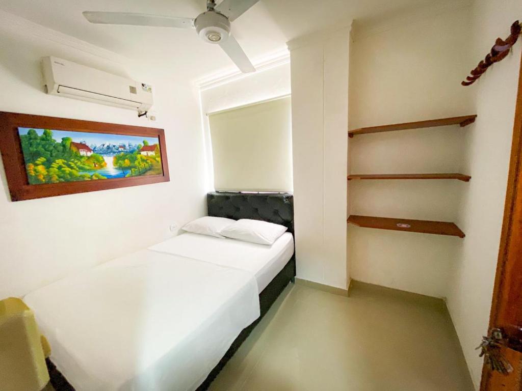 Postel nebo postele na pokoji v ubytování Hotel Aeromar Central