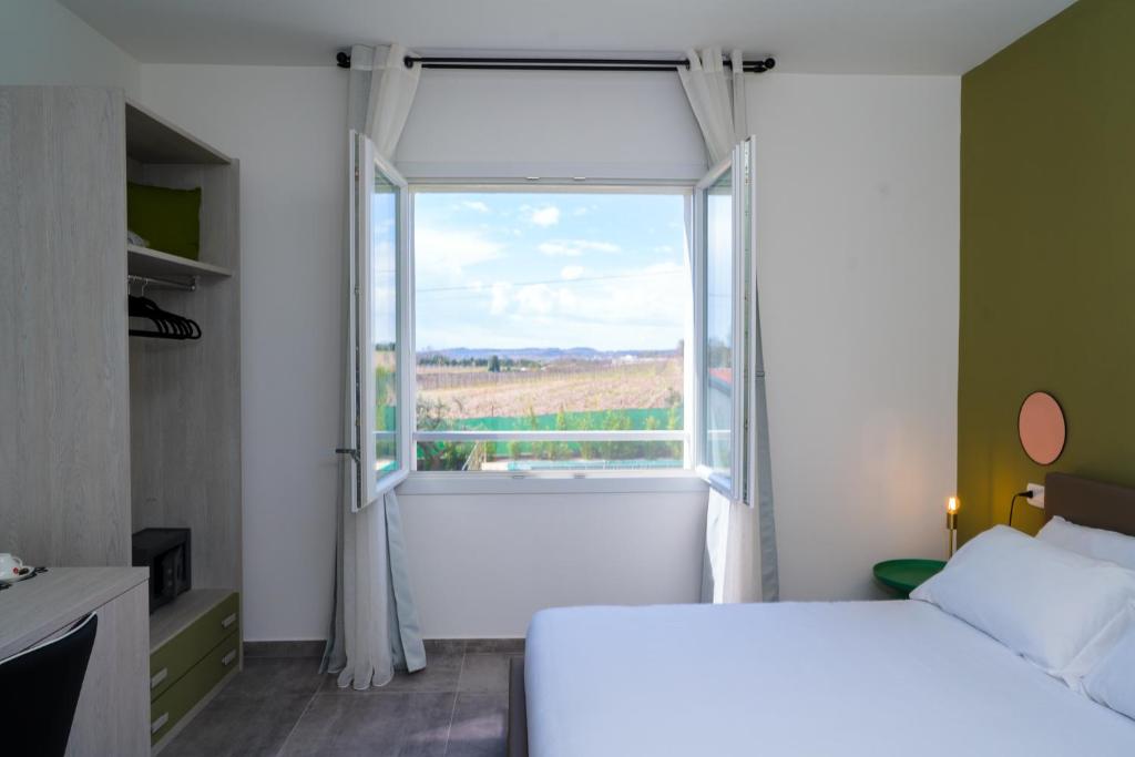 Postel nebo postele na pokoji v ubytování Mincio Relais