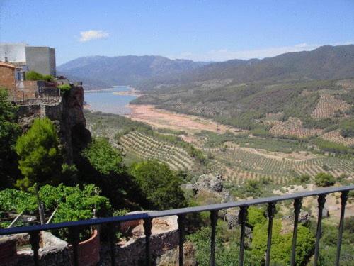 a view of a valley with a river and mountains at Casa Rural Mirador De La Luna in Hornos