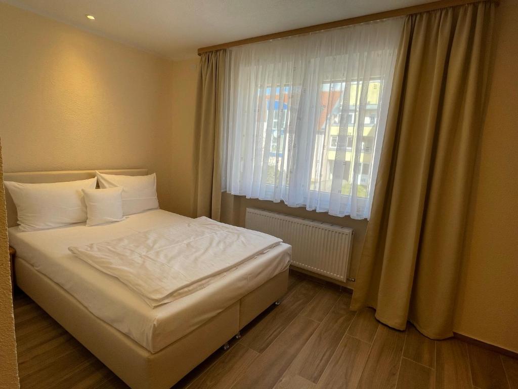 Postel nebo postele na pokoji v ubytování Hotel Andrea