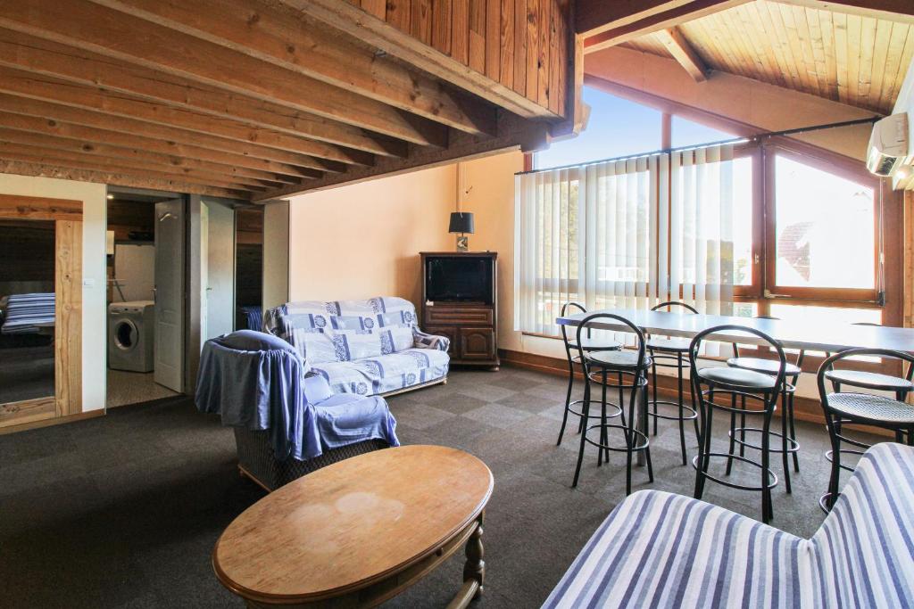 Posezení v ubytování Appartement spacieux à Échenans de 80 m² avec parking inclus