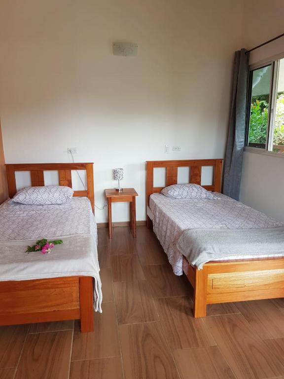 Postel nebo postele na pokoji v ubytování Magic Mountain Lodge