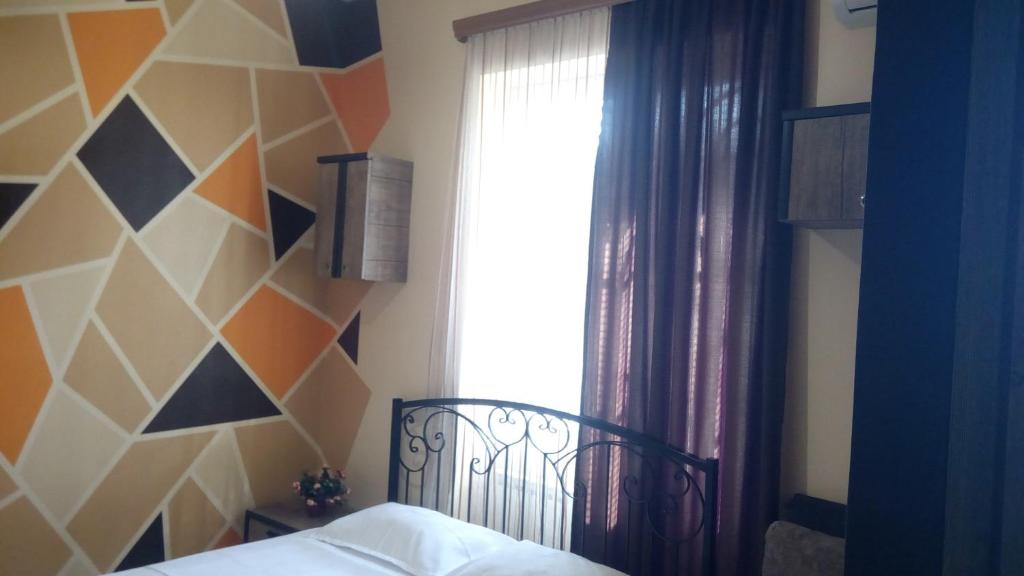 Postel nebo postele na pokoji v ubytování Hotel Isani