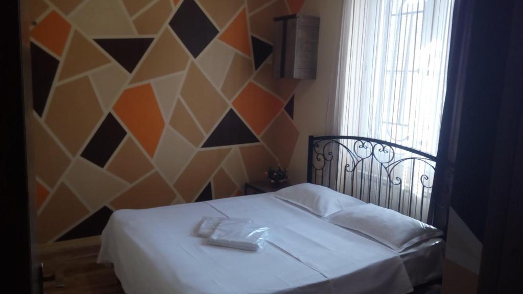 Postel nebo postele na pokoji v ubytování Hotel Isani