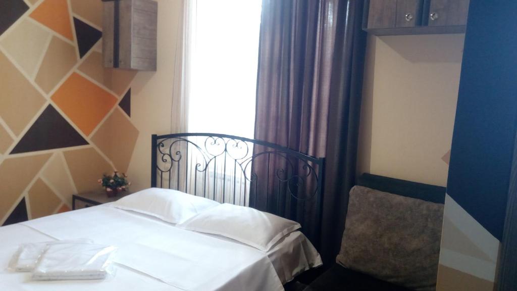 Postel nebo postele na pokoji v ubytování Hotel Isani