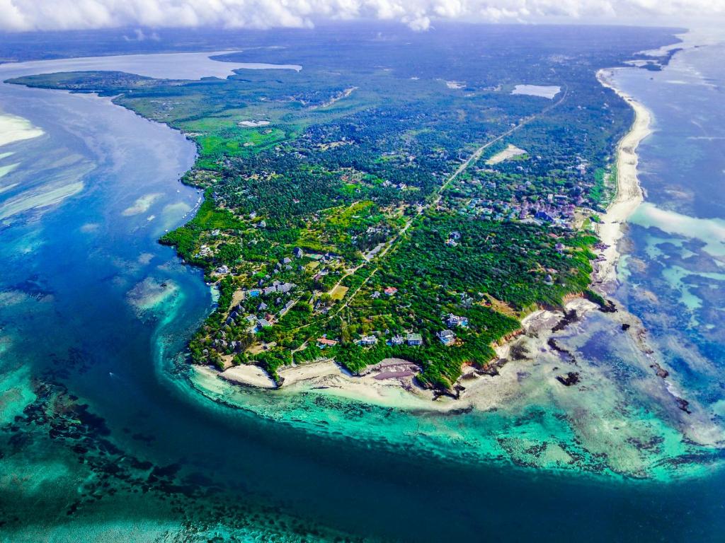 an aerial view of an island in the ocean at Temple Point Resort in Watamu