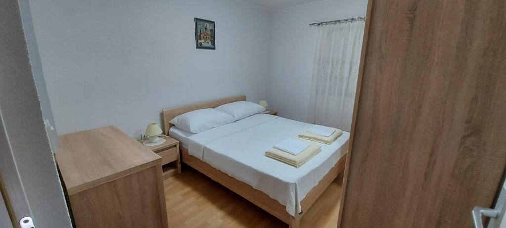 Posteľ alebo postele v izbe v ubytovaní Apartment Anchi