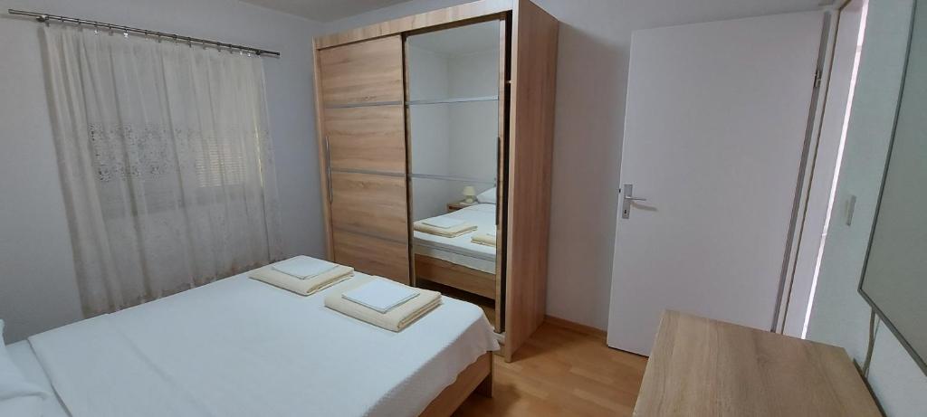 Posteľ alebo postele v izbe v ubytovaní Apartment Anchi