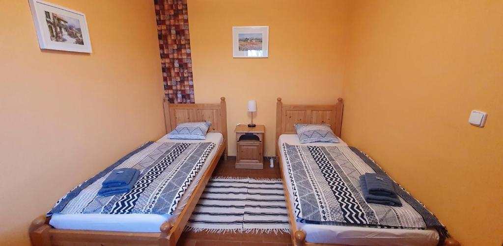 Postel nebo postele na pokoji v ubytování Penzion Na Lednické