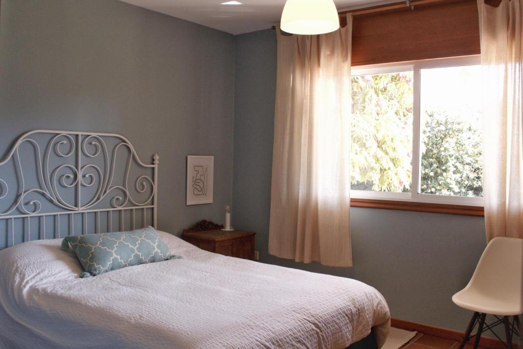 Postel nebo postele na pokoji v ubytování Casa da Glicia, una casa con piscina privada, para disfrutar y relajarse
