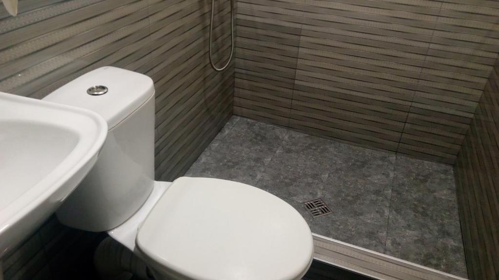 Koupelna v ubytování Hotel Isani
