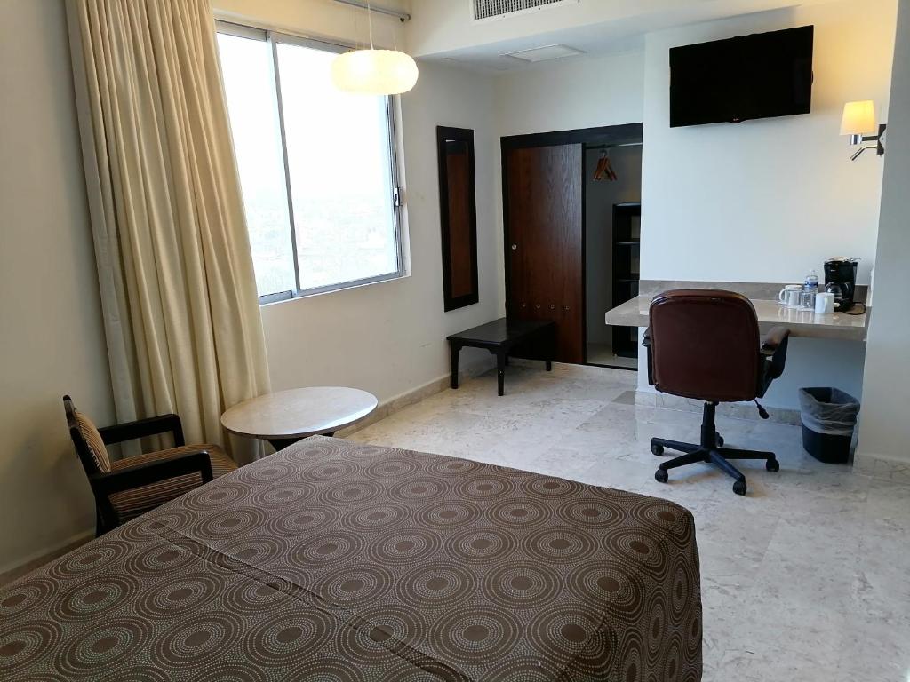 Postel nebo postele na pokoji v ubytování Hotel Mar y Tierra