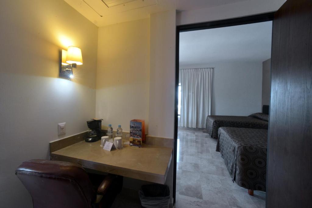 Postel nebo postele na pokoji v ubytování Hotel Mar y Tierra