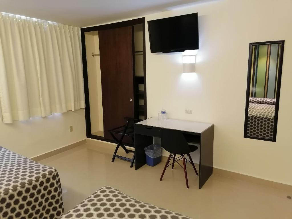 TV a/nebo společenská místnost v ubytování Hotel Mar y Tierra