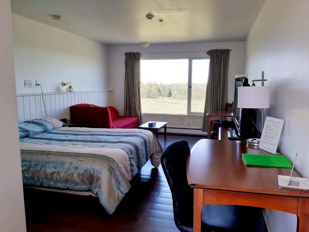 Postel nebo postele na pokoji v ubytování Balmoral Motel