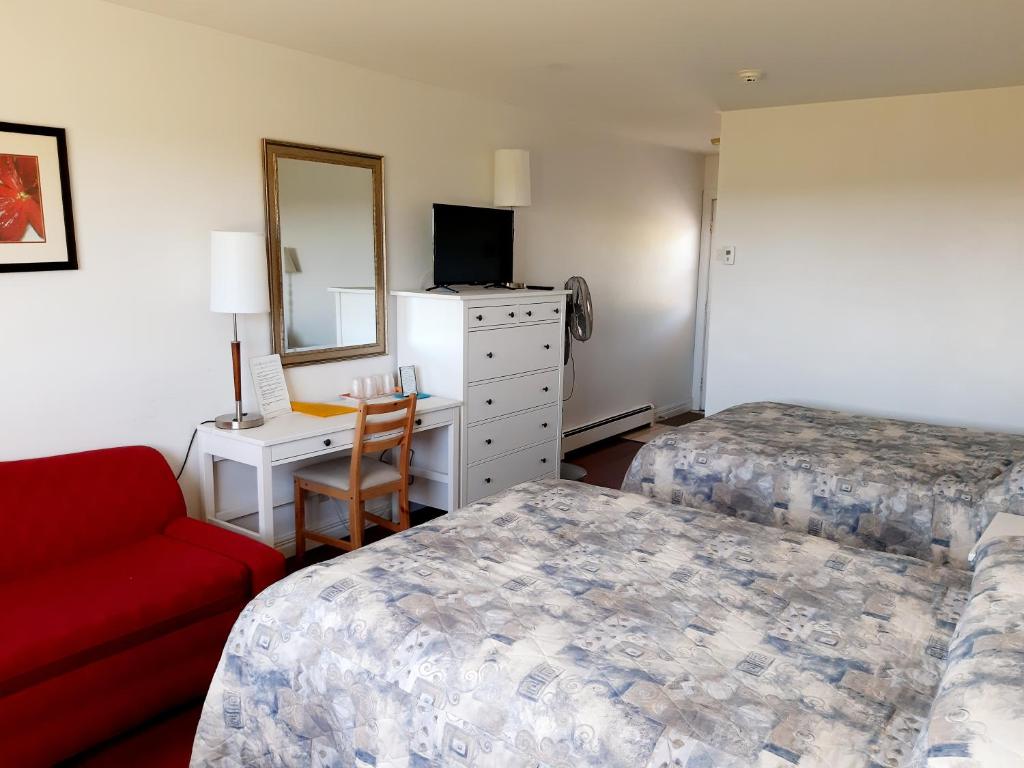 Postel nebo postele na pokoji v ubytování Balmoral Motel