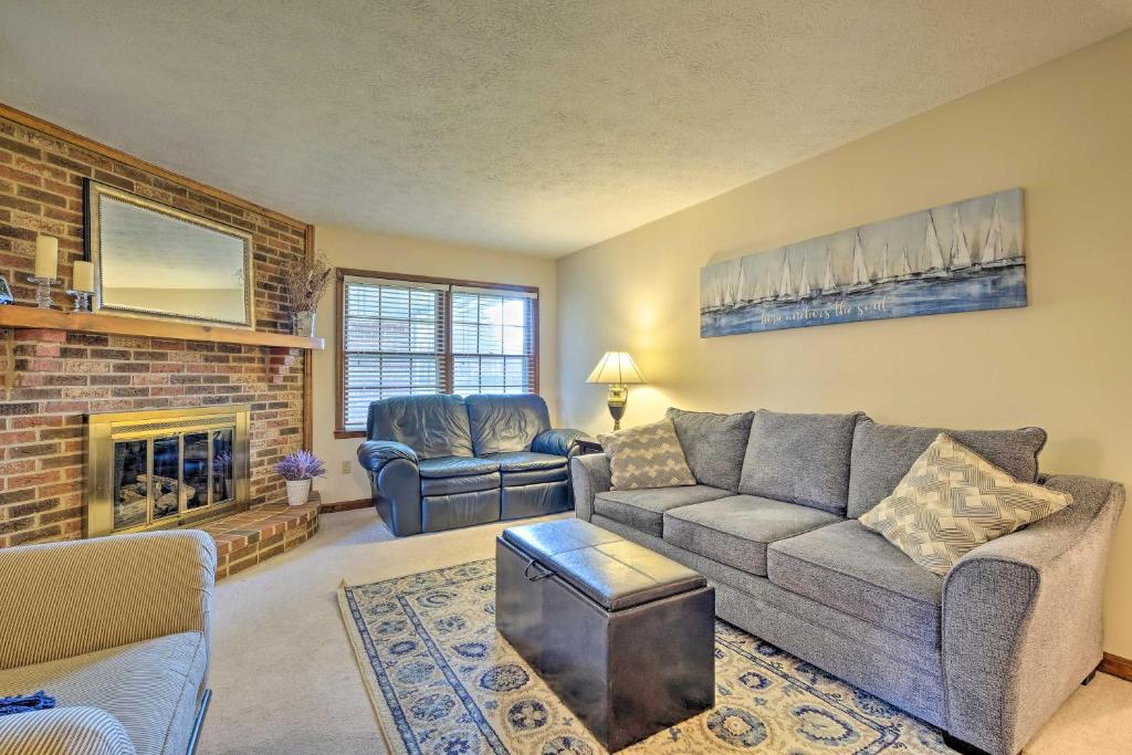 a living room with a couch and a fireplace at Lexington Home about 2 Mi to University of Kentucky! in Lexington