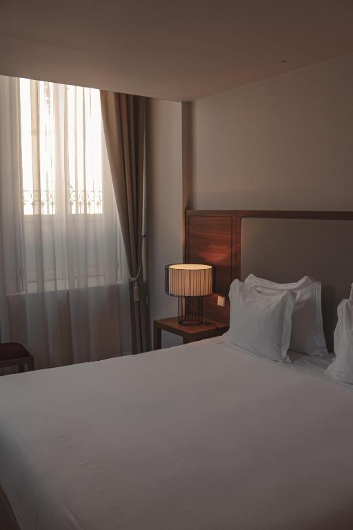 Postel nebo postele na pokoji v ubytování Burgus Tribute & Design Hotel