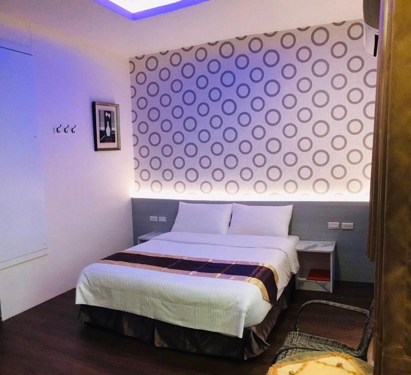 Postel nebo postele na pokoji v ubytování Purple Shell Homestay