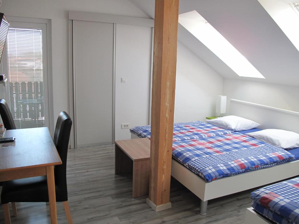 Postel nebo postele na pokoji v ubytování Guesthouse Ursula