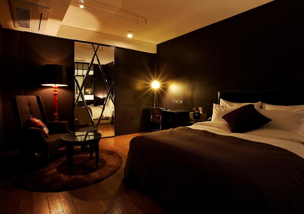Postel nebo postele na pokoji v ubytování Lee Design Hotel