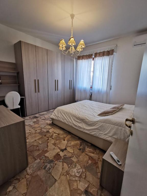 A bed or beds in a room at Appartamento Miramare