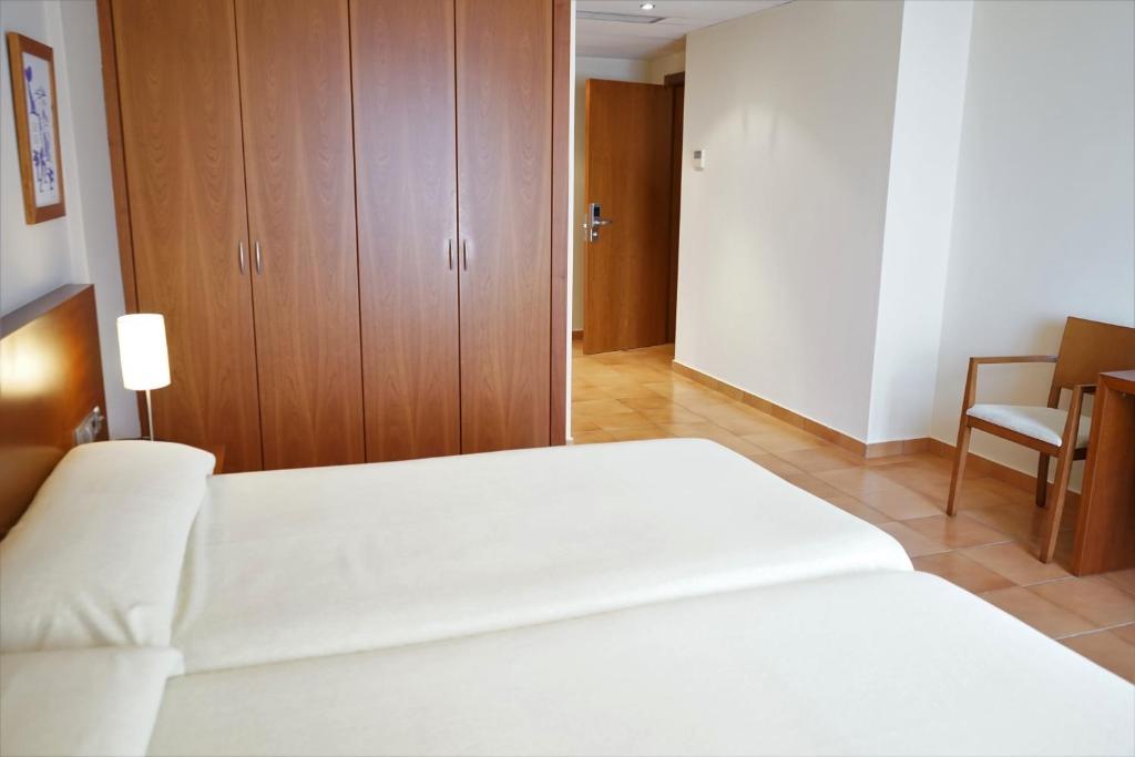 Postel nebo postele na pokoji v ubytování Hotel Santuari Balaguer