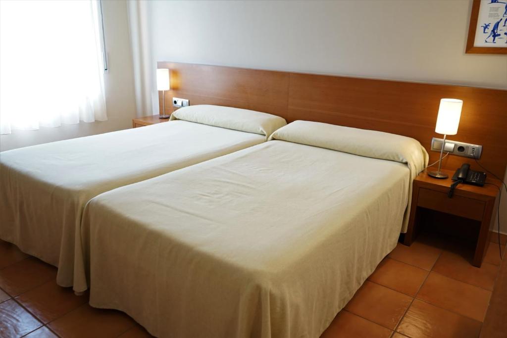 Postel nebo postele na pokoji v ubytování Hotel Santuari Balaguer