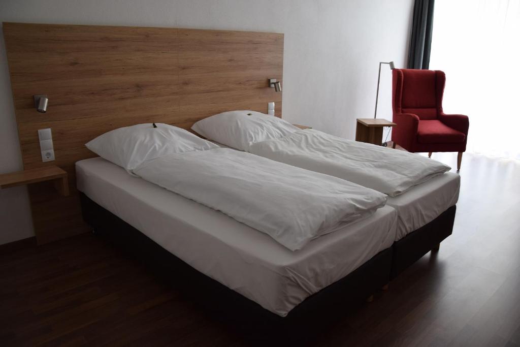 Postel nebo postele na pokoji v ubytování Hotel Sammeth Bräu