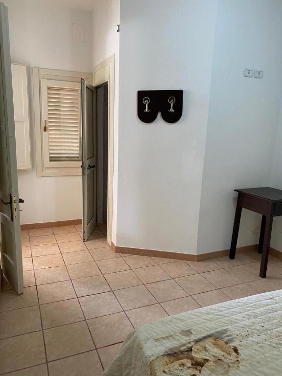 Łóżko lub łóżka w pokoju w obiekcie Villa Camelia By Cala Salento