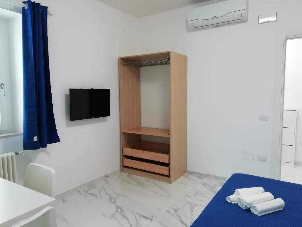 TV a/nebo společenská místnost v ubytování B&B L'Altare Bianco