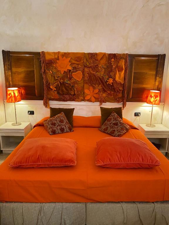 Łóżko lub łóżka w pokoju w obiekcie Art Hotel Al Fagiano