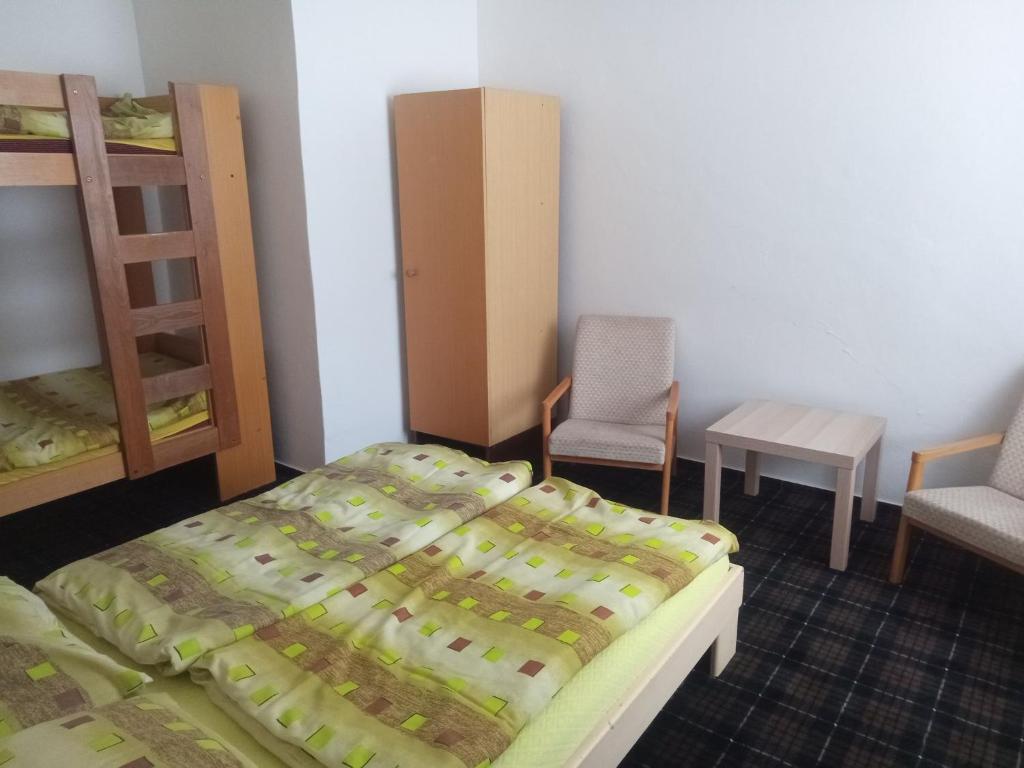 Postel nebo postele na pokoji v ubytování Penzion Chata Na Mlýně