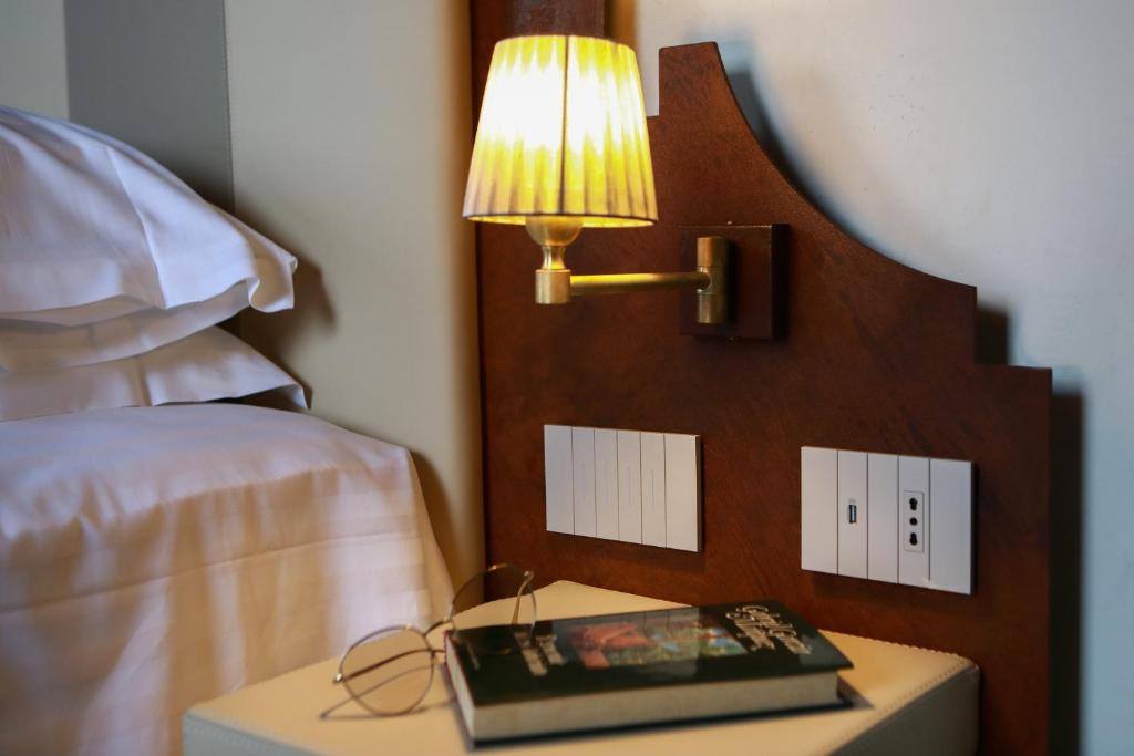 Postel nebo postele na pokoji v ubytování Corte Regia Relais & Spa