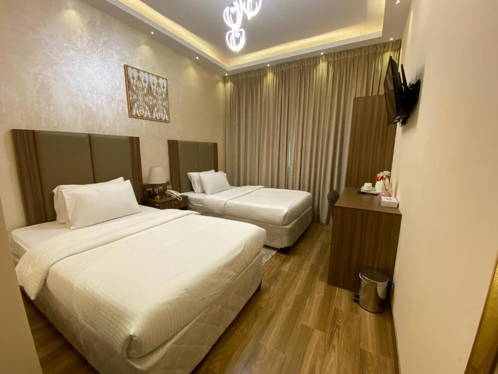 Postel nebo postele na pokoji v ubytování Panorama Hotel Deira