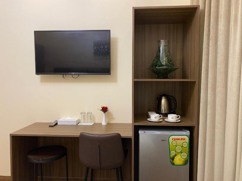 TV a/nebo společenská místnost v ubytování Panorama Hotel Deira