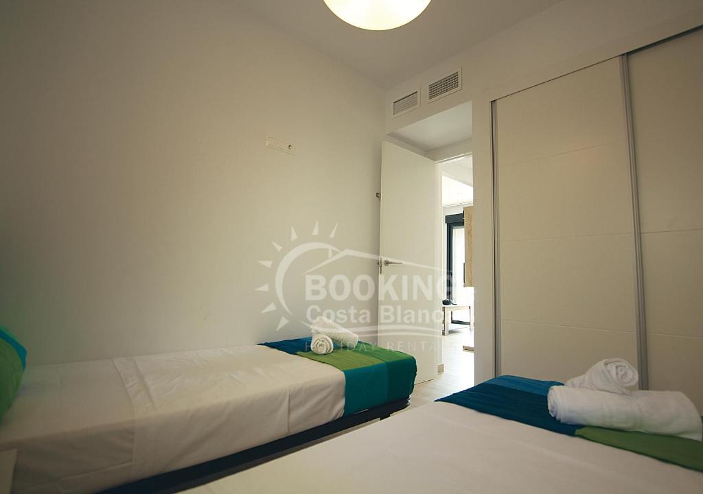 Postel nebo postele na pokoji v ubytování AL045 Pinada Beach III La Mata