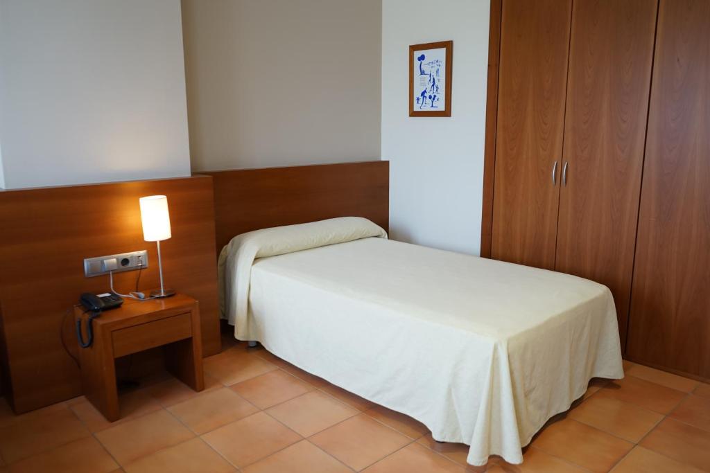 Postel nebo postele na pokoji v ubytování Hotel Santuari Balaguer