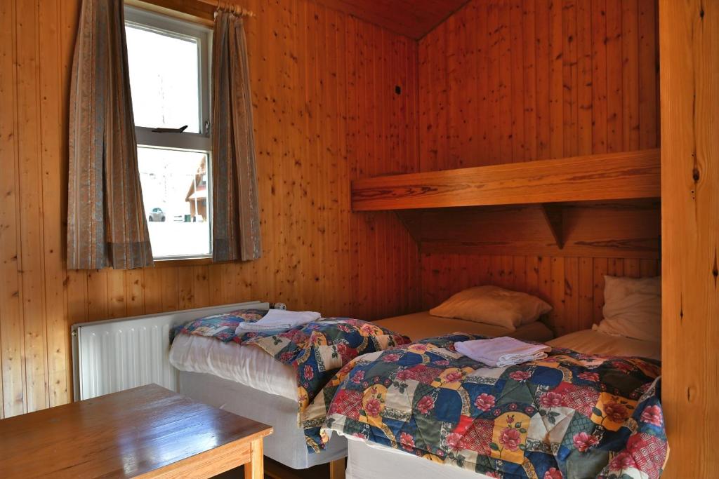 Postel nebo postele na pokoji v ubytování Kaffi Holar Cottages and Apartments