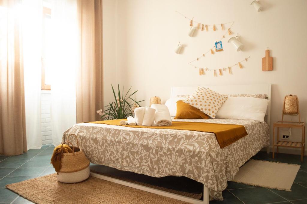 a bedroom with a bed and a clock on the wall at PURA B&b in Noicattaro