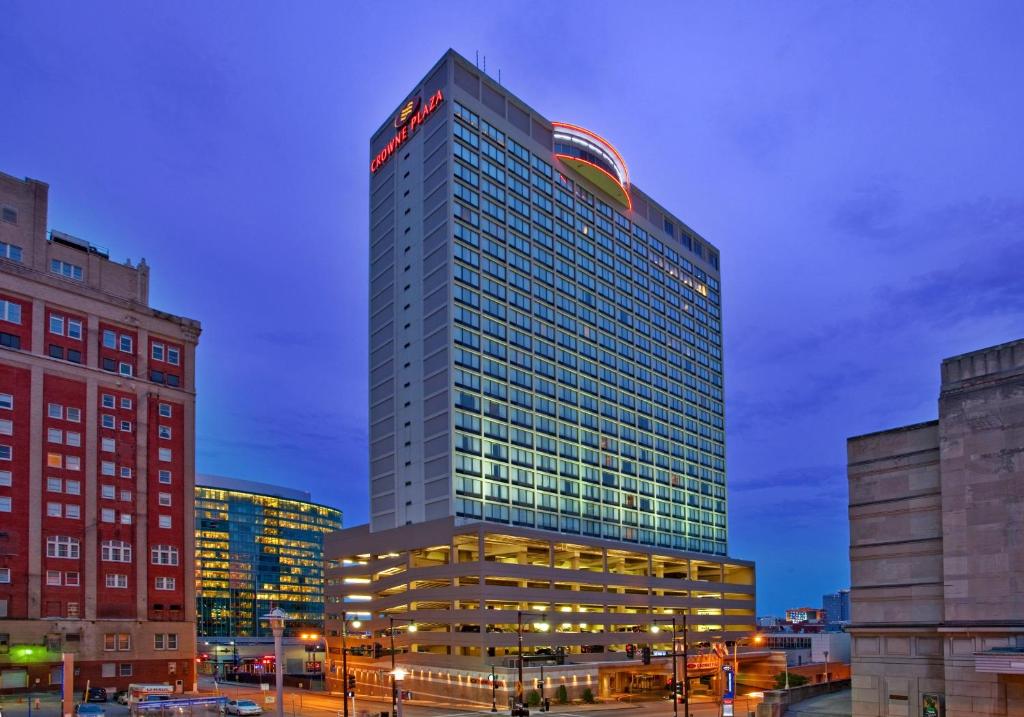 a tall building with a sign on the top of it at Crowne Plaza Kansas City Downtown, an IHG Hotel in Kansas City