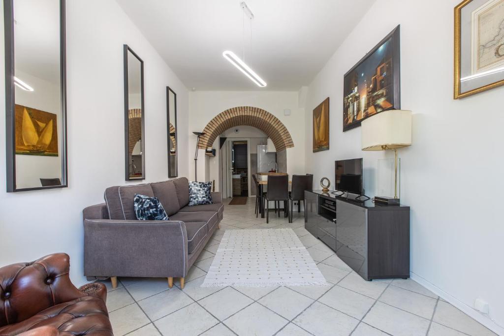 a living room with a couch and a table at ,,La Chaumière d’Azur” in Roquebrune-Cap-Martin