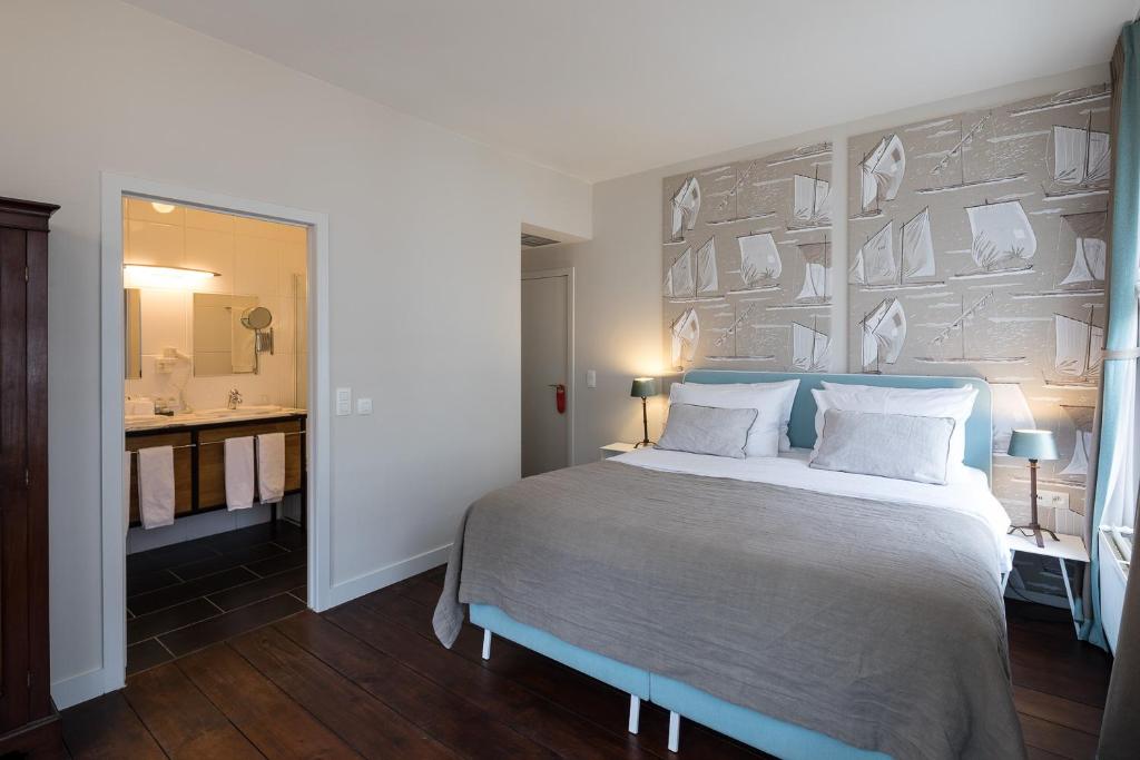 Postel nebo postele na pokoji v ubytování Hotel 'T Sandt