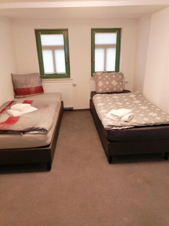 Postel nebo postele na pokoji v ubytování Kunstgasse 4+5
