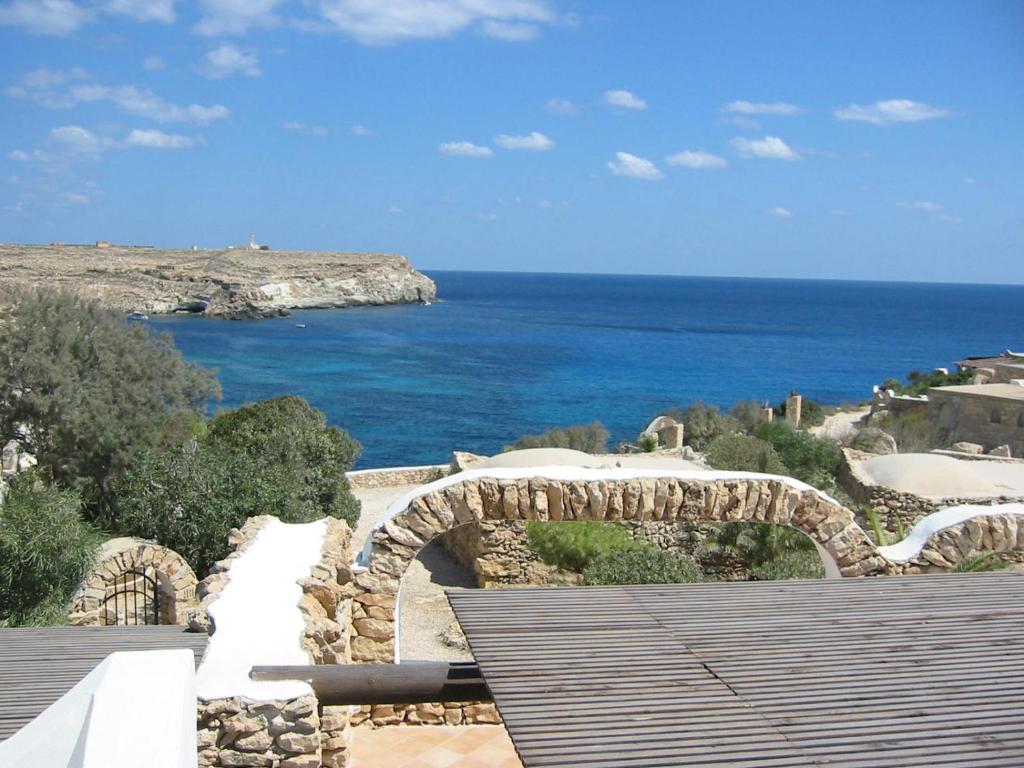a view of the ocean from a building at I Dammusi di Borgo Cala Creta in Lampedusa