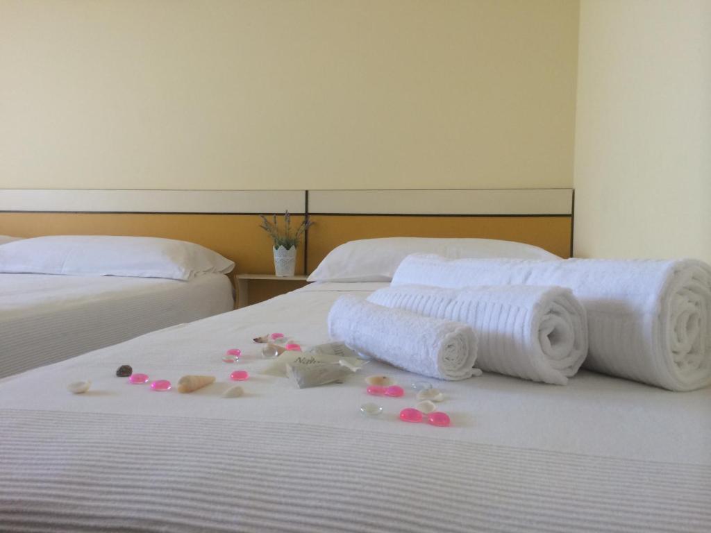 Postel nebo postele na pokoji v ubytování Alice Hotel