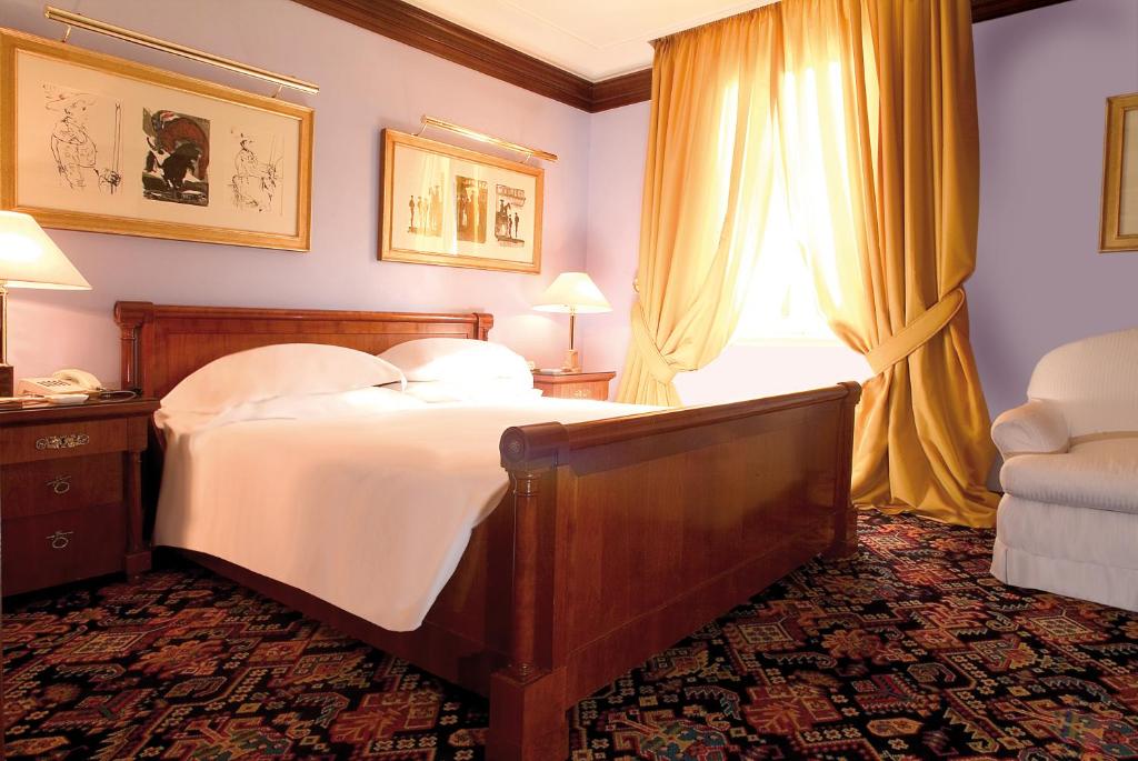 Postel nebo postele na pokoji v ubytování Hotel Albani Firenze