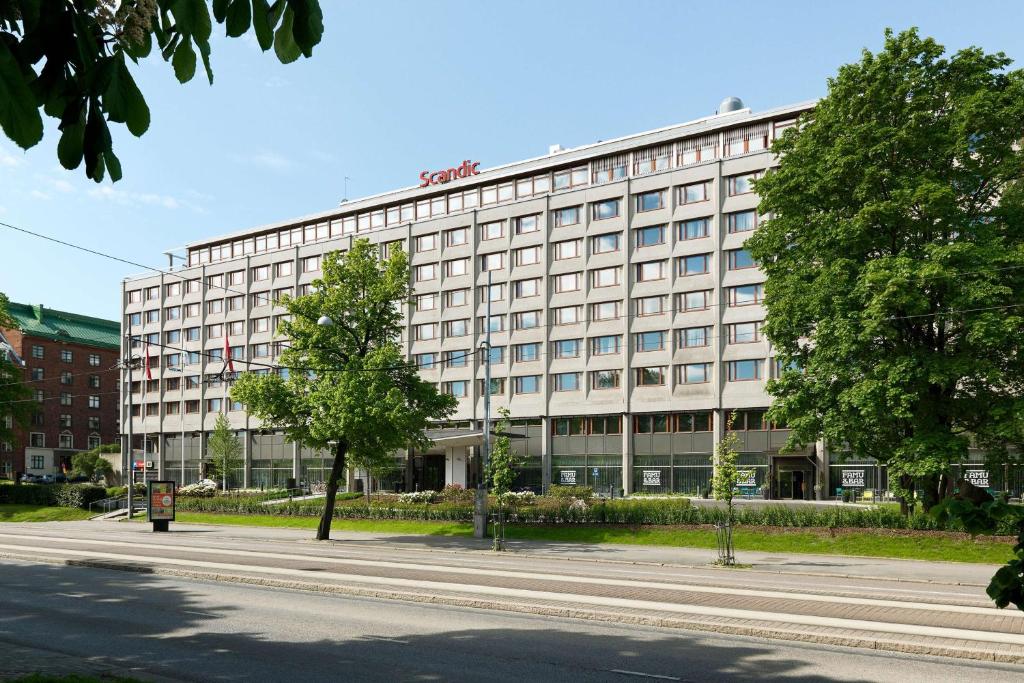 a large building on the side of a street at Scandic Park Helsinki in Helsinki