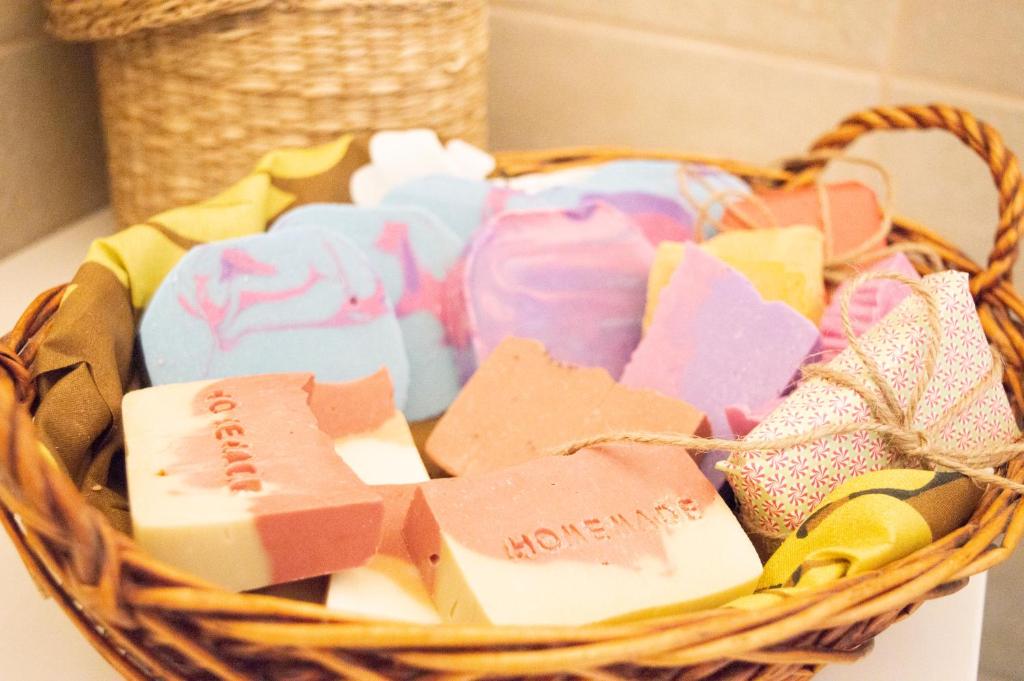 a basket filled with different types of soap at PURA B&b in Noicattaro