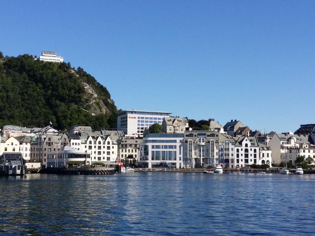 a group of buildings on the shore of a body of water at Scandic Parken in Ålesund